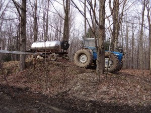 A tank of sap from a collection point is brought to the Sugarbush for unloading