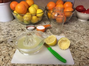 Squeezing the lemons with a classic juicer